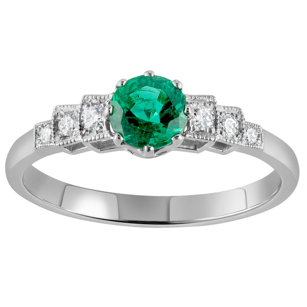 Art Deco emerald ring in platinum with diamond shoulders