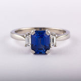 Blue sapphire emerald cut engagement ring in platinum