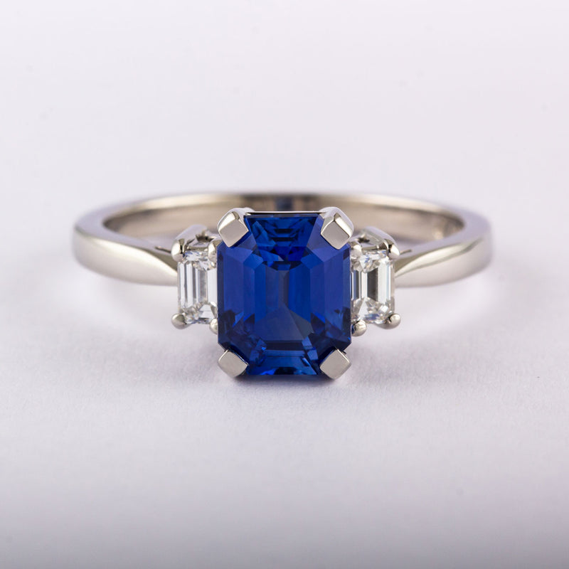 Blue sapphire emerald cut engagement ring in platinum