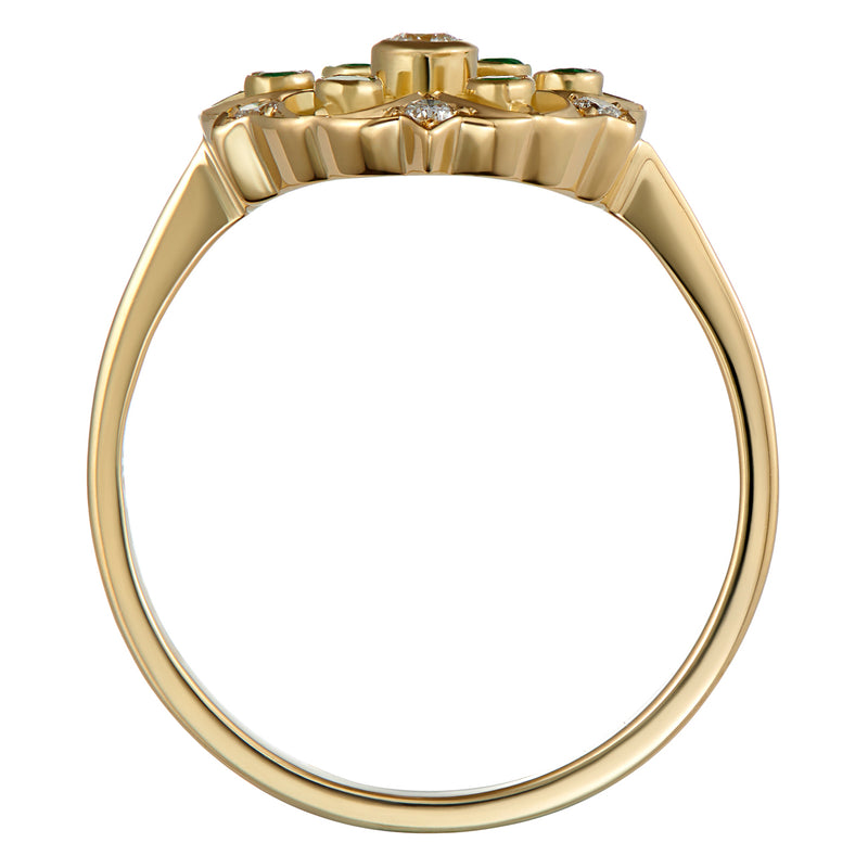 Diamond ring with emerald accents in yellow gold