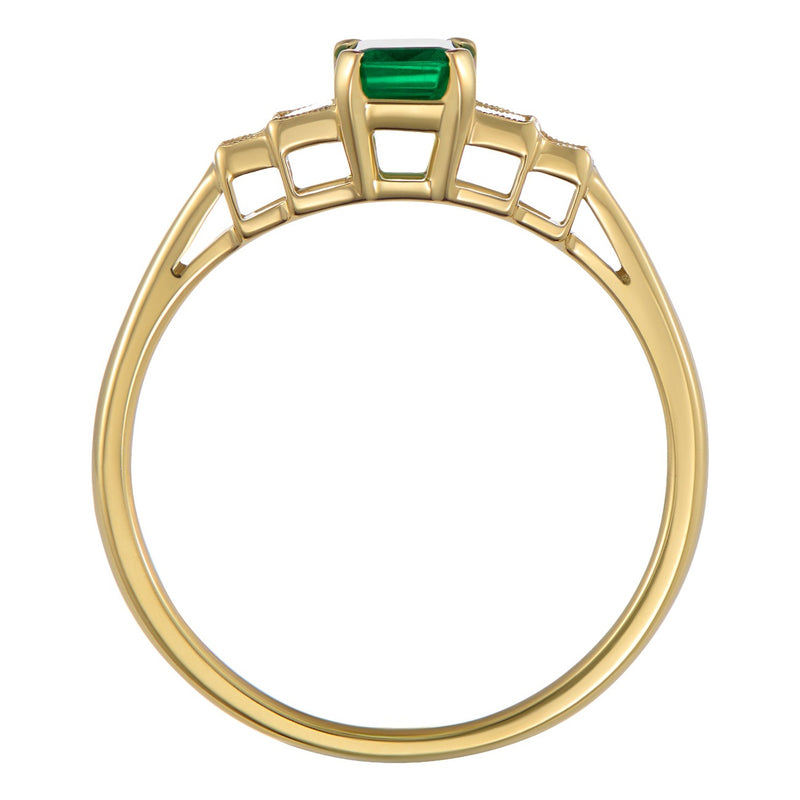 Emerald and diamond engagement ring with five stone design in yellow gold