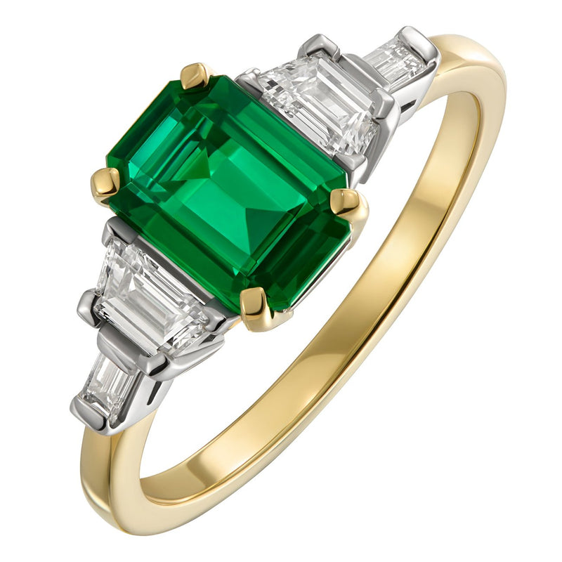 Emerald ring with trapezoid and baguette diamonds in gold and platinum