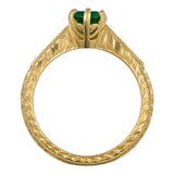 Engraved yellow gold emerald ring with shoulder diamonds