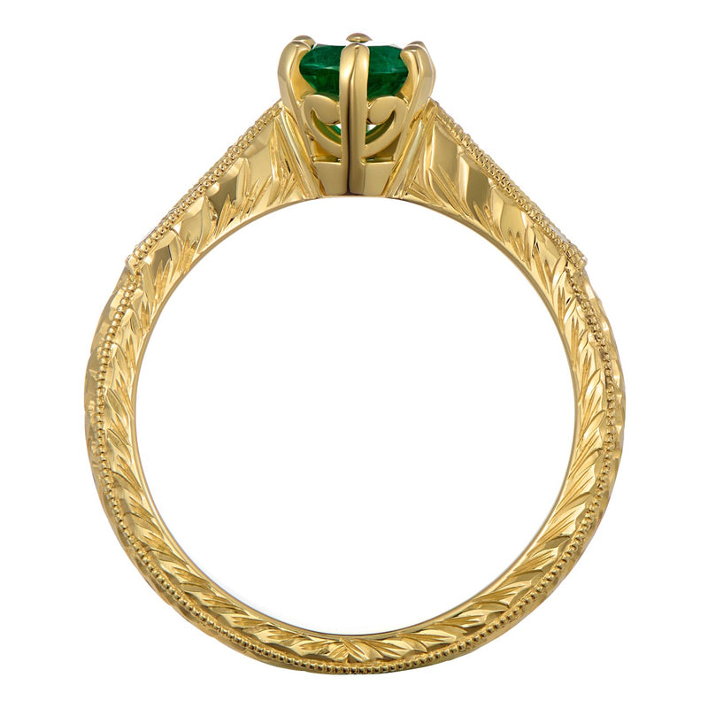 Engraved yellow gold emerald ring with shoulder diamonds