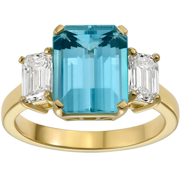 Large aquamarine engagement ring with diamonds and yellow gold band