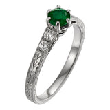 Laurel engraved emerald ring with diamond set shoulders in platinum