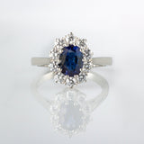 Oval sapphire and diamond vintage halo ring in platinum