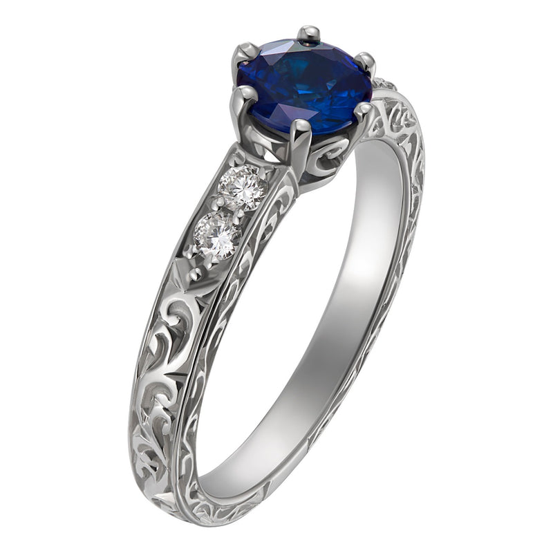 Platinum engraved sapphire engagement ring with round diamonds