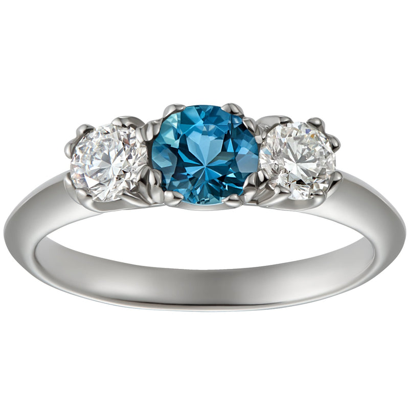 Three stone aquamarine engagement ring with diamonds in platinum