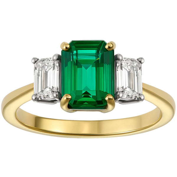 Three stone emerald and diamond ring in yellow gold and platinum