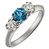 Trilogy aquamarine and diamond engagement ring in platinum