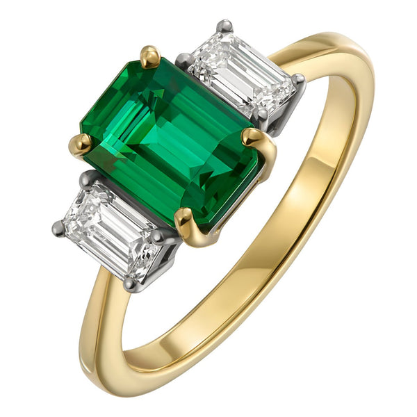 Trilogy emerald and diamond engagement ring in platinum and gold