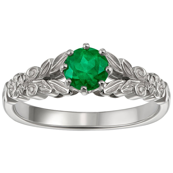 Vintage emerald engagement ring with flower engraving in platinum