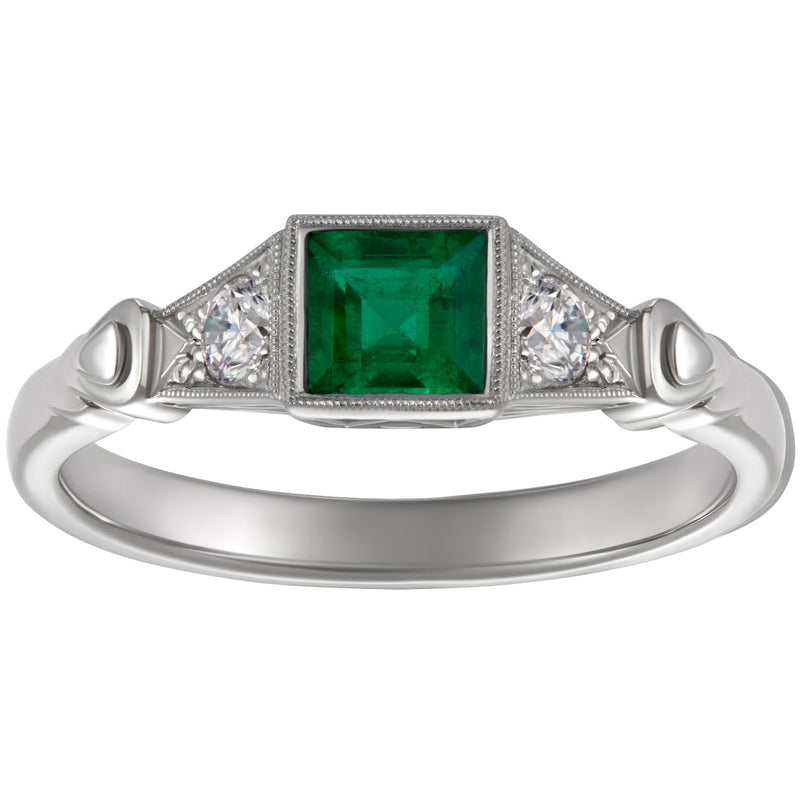 Vintage emerald engagement ring in platinum with triangle motif