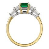 Vintage emerald engagement ring with trapezoid and baguette diamonds