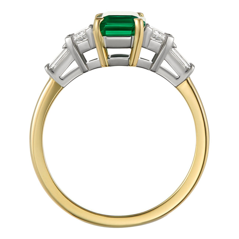 Vintage emerald engagement ring with trapezoid and baguette diamonds