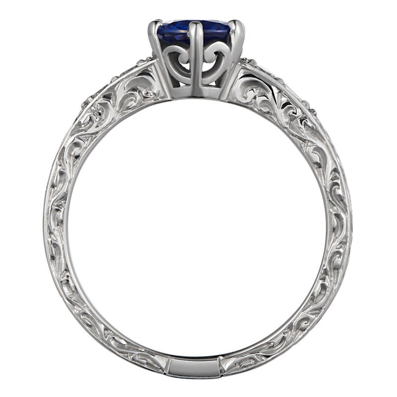 Vintage engraved sapphire and diamond ring in platinum