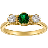 Vintage three stone emerald and diamond ring in yellow gold