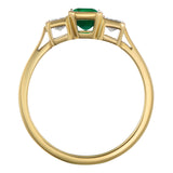 Yellow gold trilogy emerald ring with diamond side stones