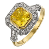 Yellow sapphire and diamond halo engagement ring in yellow gold and platinum